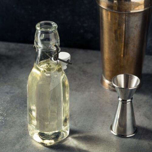 Simple syrup in a glass bottle.