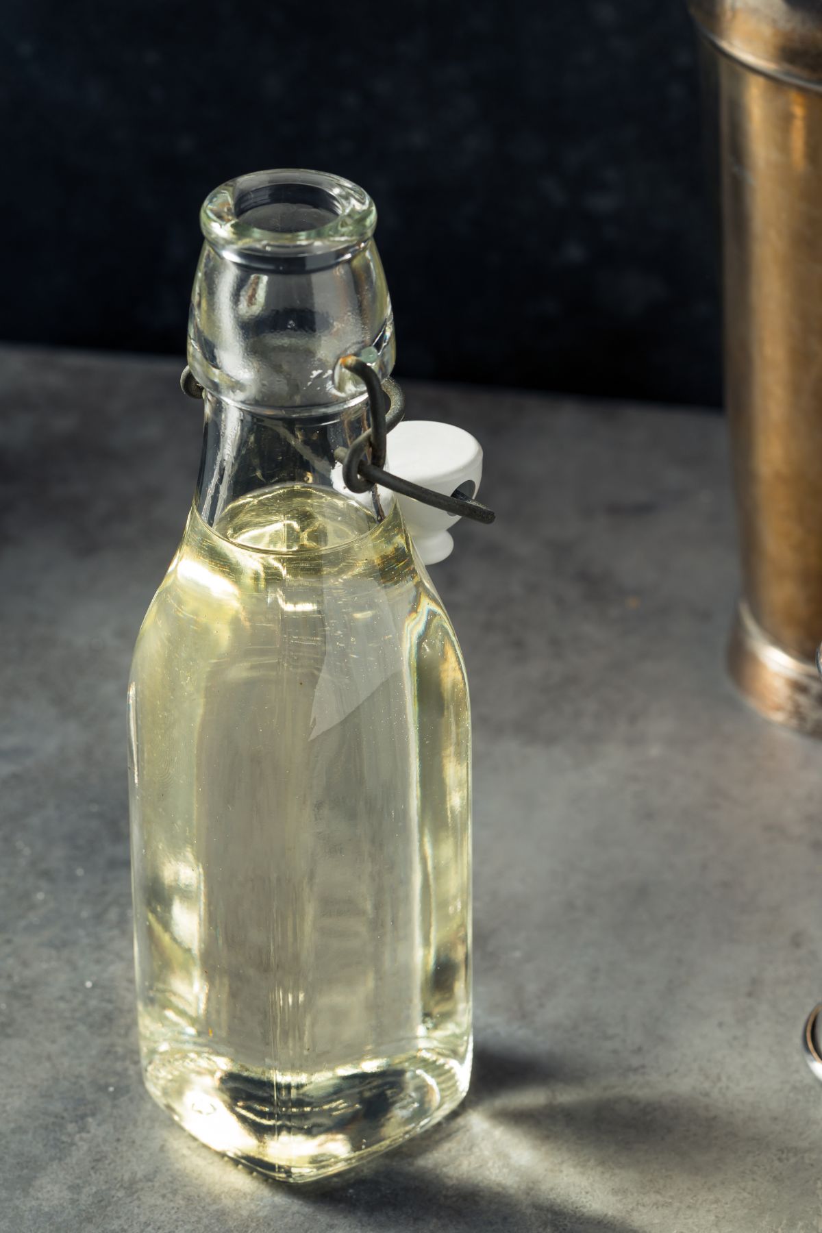 Simple syrup for a cocktails in a glass bottle.